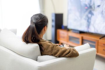 Poster - Woman play video game at home