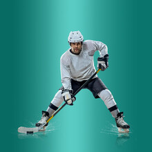 Professional Ice Hockey Player Hitting Puck For Winning Goal In Action On Gradient Multicolored Neon Background. Concept Of Sport Competition.