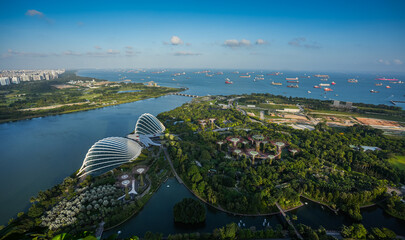 Wall Mural - Gardens by the Bay landmark of Singapore, view from above with beautiful sunset light. Amazing aerial view of this futuristic construction in Singapore, 2023.