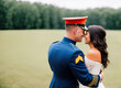 Candid wedding photo of a US Marine in formalwear with bride, celebrating love and commitment, blending military tradition and romance, generative ai