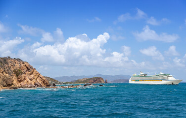 Wall Mural - Luxury cruise ship sailing from port on sunny day