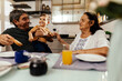 © kleberpicui - Happy grandparents having breakfast with their grandson