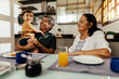 © kleberpicui - Happy grandparents having breakfast with their grandson