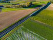 Aerial view of an ICE express train between fields in the countryside