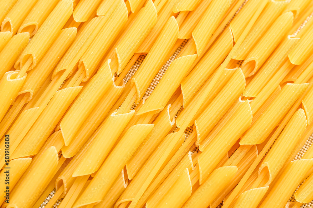 Raw spaghetti and penne pasta, closeup