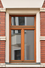 Sticker - View of brick building with wooden window