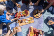 © Wavebreak Media - Overhead of happy group of diverse senior friends having picnic and drinking in garden on sunny day