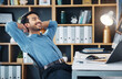 © Allistair/peopleimages.com - Happy business man stretching to relax from easy project, complete achievement and happiness in office. Worker, smile and hands behind head to finish tasks, rest and break for productivity at desk