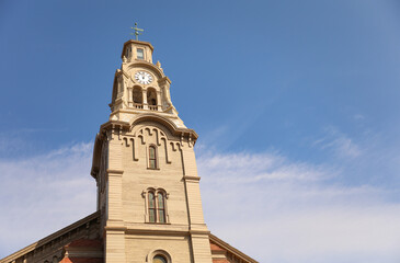 historical church landmark with ancient architectural tower with european style medieval design down