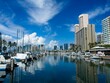© Andrew Webb Curtis - Puffy clouds drift overhead the high rises of Honolulu's Waikiki area
