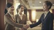 © Get Stock - Professional Workplace Female Women: Asian Hotel managers Greeting with Confidence Friendliness in Business Setting, Diversity Equity Inclusion DEI Celebration (generative AI