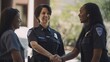 © Get Stock - Professional Workplace Female Women: Multiracial Police officers Greeting with Confidence Friendliness in Business Setting, Diversity Equity Inclusion DEI Celebration (generative AI