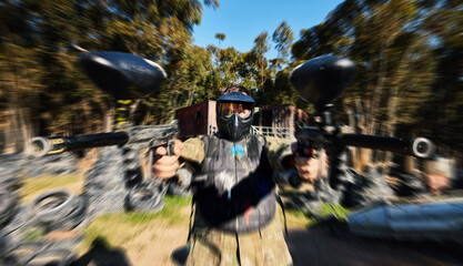 Wall Mural - Man, paintball and dual wield gun for rapid fire, intense battle or war in the forest pushing to attack. Active army soldier holding guns for fast firing in extreme adrenaline sport competition