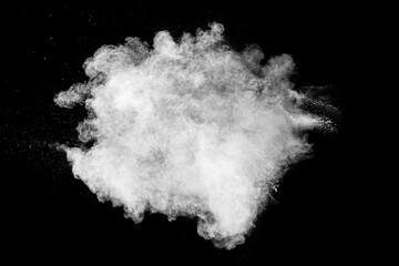 white powder explosion cloud against black background. white dust particles splash.
