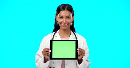 Sticker - Tablet, green screen and doctor face isolated on blue background telehealth, medical or service software app. Healthcare professional or indian person on digital technology, studio and mockup space