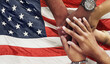 © Allistair/peopleimages.com - Teamwork, support and hands stacked on American flag for community together in collaboration for the country. Group, unity and closeup of international team meeting in trust, activism and victory