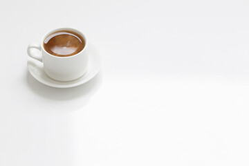 Wall Mural - white cup of coffee  on white table