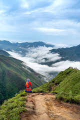 Poster - Hiking tourists explore the trail on spine and the top of the mountains Hang Dong. This is a very popular tourist destinat in Hang Dong commune, Bac Yen district, Son La Province, Vietnam 