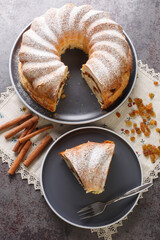 Wall Mural - Carinthian Easter Reindling cake close-up in a plate on the table. Vertical top view from above