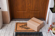 © New Africa - Parcel delivered on mat near front door