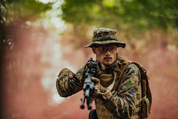 A modern warfare soldier on war duty in dense and dangerous forest areas. Dangerous military rescue operations