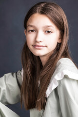 Wall Mural - Studio portrait of a young teen girl