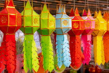 Beautiful Colourful Traditional Handmade Thai Lanna Lantern, Selective Focus Of Multicolour Of Lamps In Northern Style Hanging On The Rope In Temple, Thai Object, Thailand.