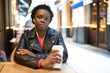 © ADDICTIVE STOCK - Serious black woman with coffee