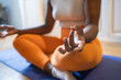 © ADDICTIVE STOCK - Crop black woman doing yoga exercise