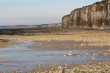 big white chalk cliffs and the beach at the french coast in Normandy 