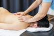 © Rokas - A professional masseuse gives a massage to a young, attractive woman. Body care. Massage therapist. Pretty woman relaxing in massage salon. Natural beauty close up shot