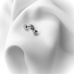 Stylish earrings in white gold with diamonds on the fabric.