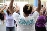 A Zumba instructor leading a crowd of women