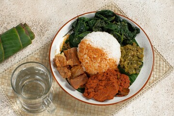 Nasi Padang with rendang is an Indonesian food from West Sumatra in Indonesia. Nasi Padang as favorites food for Indonesian people.