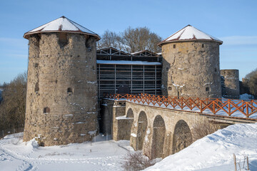 Wall Mural - Towers and bridge of the ancient Koporye fortress close-up on a February afternoon. Leningrad region, Russia