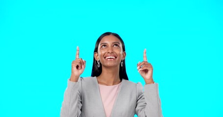 Wall Mural - Face, employee and Indian woman pointing up, direction and happiness against a blue studio background. Portrait, female entrepreneur or lady with decision, inspiration or choice with joy or smile