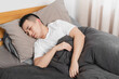 © Anciens - Asian man is sleeping in the bed.