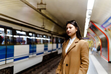 Asian Girl Waiting For The Subway On The Platform