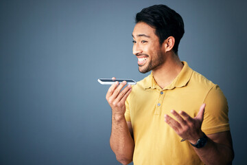 Mockup, phone call and Asian man with speaker, conversation and connection against a studio background. Japan, male and guy with smartphone, talking and discussion with network signal and happiness