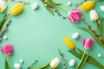 Wall Mural - Easter atmosphere concept. Top view photo of quail eggs pussy-willow and colorful tulips on isolated turquoise background with empty space in the middle