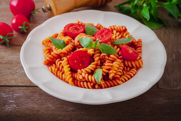 Wall Mural - Fusilli pasta with tomato sauce and basil