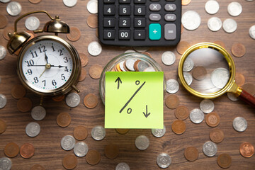 Wall Mural - Percentage symbol on sticky note with a coins.