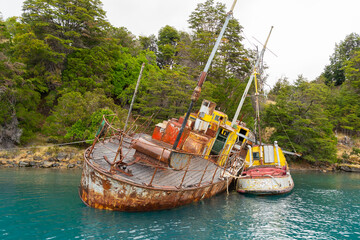 Wall Mural - An old shipwreck on the General Carrera Lake near Puerto Rio Tranquilo in Chile. 