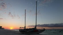 A Sailboat That Had Washed Up On The Beach In Destin Florida After Breaking Loose From It's Moorings During A Hurricane.