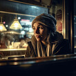 Generative AI - A homeless woman sitting at a table in a restaurant looking out the window at the street lights and a lamp, cinematic photography, a character portrait, art photography