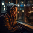 Generative AI - A homeless woman looking out a window at the street at night time, with a hoodie on,  cinematic photography, a character portrait, American realism