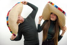 Crazy Travelers Funny Photo Antics Entertainment Man And A Girl Grimacing Sticking Out Their Tongues And Making Faces Sombrero Hats Mexican Color Tradition Funny Photo Ad Travel Entertainment Buzz