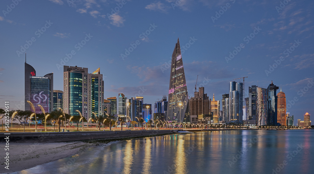 Doha Qatar skyline from corniche promenade at dusk showing West Bay ...