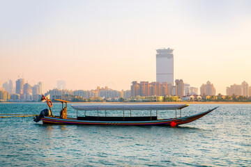 Sticker - Dubai, UAE. Tourists boat at Palm Jumeirah  at sunset