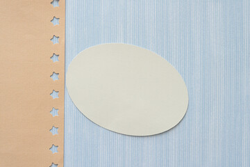 Sticker - beige paper with stars, oval, and blue scrapbook paper with pattern